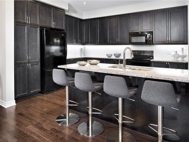 The Amherst has a clean lined, crisp black and white palette for the kitchen, which complements the greys found throughout the rest of the main floor.