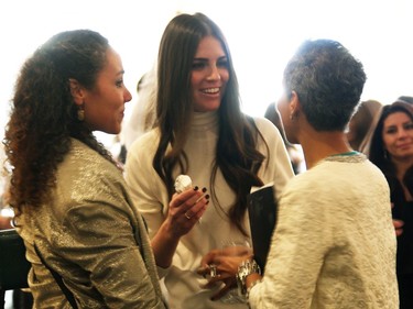 From right, breast cancer survivor Alison Hughes is congratulated on her keynote speech by her sister, Joanna, and event organizer Erica Wark, centre, at the Revive Your Style fundraiser for breast health, held Sunday, January 25, 2015, at the Sala San Marco.