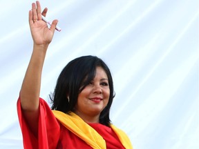 In this Friday, Jan. 1, 2016 photo, Gisela Mota waves during her swearing in ceremony as mayor of Temixco, Morelos State, Mexico. The Morelos state Public Security Commission says attackers invaded Mota's house on Saturday morning and killed her.