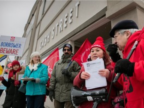 Gisele Bouvier, right, rallies demonstrators in a protest against the profusion of payday loan operators in Vanier.