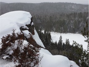 Huge granite rocks and white pines are a natural frame for the view from Eagle's Nest lookout near Calabogie. Local First Nations people have long believed the spot is a sacred place that helps humans fulfill a spiritual journey.