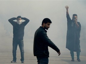 Kashmiri Shiite protesters shout slogans as they stand among clouds of teargas during a demonstration in Srinagar on January 3, 2016, against the execution of prominent Shiite Muslim cleric Nimr al-Nimr by Saudi authorities.  Saudi Arabia on January 2, executed 47 people convicted of "terrorism", including a prominent Shiite cleric behind anti-government protests, the interior ministry said.  The cleric, Nimr al-Nimr, was a driving force of the protests that broke out in 2011 in the Sunni-ruled kingdom's east, where the Shiite minority complains of marginalisation.