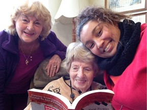 Norma Beers reads with her daughter, Janet Beers, left, and her granddaughter, Natalie Fraser, right. RISE Sunday on Feb. 21 is part of a national awareness campaign based in Ottawa called Reach Isolated Seniors Everywhere. The purpose of the campaign is to help Canadians become aware of the impact of social isolation on the older people in their lives.