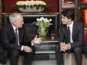 Johann Schneider-Ammann, left, President of the Swiss Confederation talks with Canada's Prime Minister Justin Trudeau, right, during a bilateral meeting on the sideline of the 46th Annual Meeting of the World Economic Forum, WEF, in Davos, Switzerland, Thursday, Jan. 21, 2016.