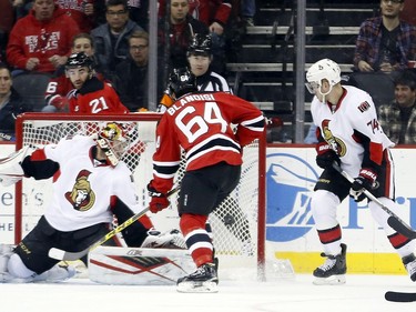 New Jersey Devils center Joseph Blandisi (64) scores his first career goal against Ottawa Senators goalie Craig Anderson (41) during the first period.