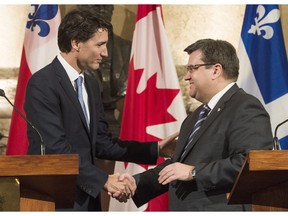 Prime Minister Justin Trudeau, left, shakes hands with Montreal Mayor Denis Coderre following their joint press conference in Montreal, Tuesday, January 26, 2016. THE CANADIAN PRESS/Graham Hughes

0127 biz gmo pipelines