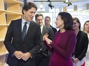 Prime Minister Justin Trudeau chats with Sheryl Sandberg, Facebook chief operating officer during a bilateral meeting in Davos, Switzerland on Wednesday, Jan. 20, 2016.