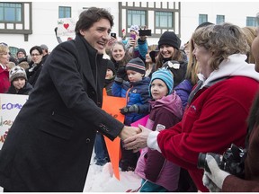 Prime Minister Justin Trudeau is greeted by supporters as he arrives for a cabinet retreat at the Algonquin Resort in St. Andrews, N.B. on Sunday. The federal Liberals will work on their plans for the year including their upcoming budget.