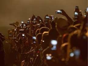 Kanye West fans use their phones to capture his Bluesfest performance last year.