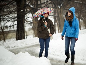 Tanya Bruinsma and Vera Kellen braved the wet weather Saturday and took a stroll along the canal.