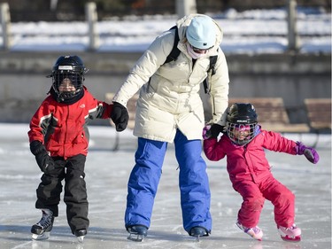 L-R: Tristan (6), Emily, and Lucy Grant (4) enjoy the opening day of the Rideau Canal Skateway on Saturday, Jan. 23, 2016.