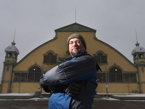 Michael Vickers, a Glebe resident, poses in front of the Aberdeen building at Lansdowne Park, Jan 28, 2016. Michael is concerned that the city of Ottawa is not doing enough to enforce its own noise bylaw at Lansdowne Park, where loud amplified music is often audible after 11 p.m.