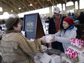 Liz Mok of Moo Shu Ice Cream sells her dark-chocolate-coated Asian ice cream truffles at the Ottawa Farmers' Market Christmas Market. She'd like the market to have a permanent home in the Aberdeen Pavilion, like Vancouver's Granville Island market.