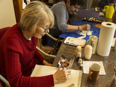 Mary MacKinnon takes part in the day hospice program at May Court. She is creating a series of nesting dolls depicting seven generations of her family, which she plans on giving to her son, Liam, as a remembrance.