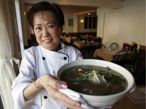 Mee Fung Trang, chef and owner of New Mee Fung restaurant on Booth Street, arrives at 5 a.m. each morning to start the beef broth simmering for her famous Pho Bo noodle soup.