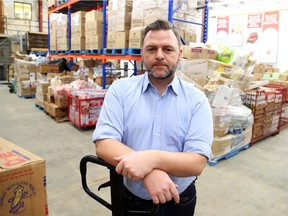 Michael Maidment, Executive Director of the Ottawa Food Bank is photographed in the organization's warehouse on Wednesday.