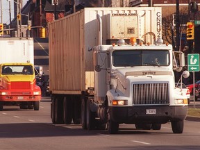 Trucks travel along King Edward Avenue toward the interprovincial bridge.