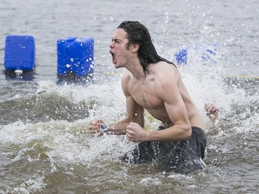 Nearly 100 people took part in the The Sears Great Canadian Chill also known as the "Polar Bear Dip" at Britannia Beach, January 1, 2016.
