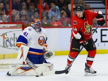 Ottawa Senators center Jean-Gabriel Pageau (44) deflects a shot on New York Islanders goalie Jaroslav Halak (41).