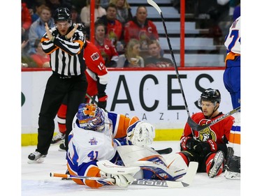 Ottawa Senators left wing Matt Puempel (26) gets called for goaltender interference on New York Islanders goalie Jaroslav Halak (41).