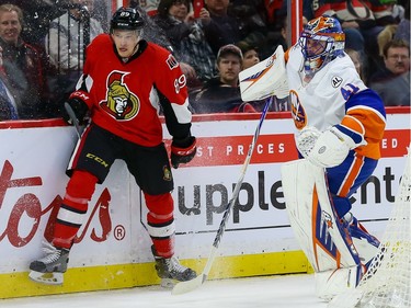Ottawa Senators left wing Max McCormick (89) and New York Islanders goalie Jaroslav Halak (41).