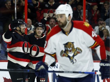 Ottawa Senators'  Milan Michalek (9) and Mike Hoffman (68) celebrate a goal against Florida Panthers' Roberto Luongo (1) during third period NHL action at the Canadian Tire Centre in Ottawa Thursday January 07, 2016. The Sens lost 3-2.