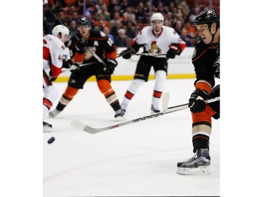 ANAHEIM, CA - JANUARY 13:  Ryan Getzlaf #15 of the Anaheim Ducks skates past Mike Hoffman #68 of the Ottawa Senators during the first period of a game at Honda Center on January 13, 2016 in Anaheim, California.