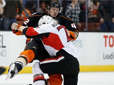 ANAHEIM, CA - JANUARY 13:  Josh Manson #42 of the Anaheim Ducks fights Mark Borowiecki #74 of the Ottawa Senators during the first period of a game at Honda Center on January 13, 2016 in Anaheim, California.