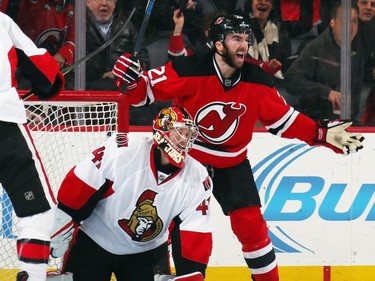 Kyle Palmieri #21 of the New Jersey Devils celebrates his goal at 7:57 of the first period against Craig Anderson #41 of the Ottawa Senators.