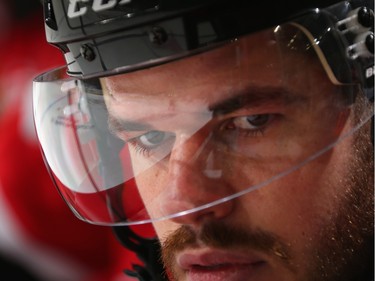 Eric Gelinas #44 of the New Jersey Devils watches the action from the bench against the Ottawa Senators.