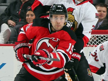 Tuomo Ruutu #15 of the New Jersey Devils keeps his eyes on the incoming puck during the second period.