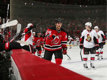 Joseph Blandisi #64 of the New Jersey Devils returns to the bench after scoring his first NHL goal.