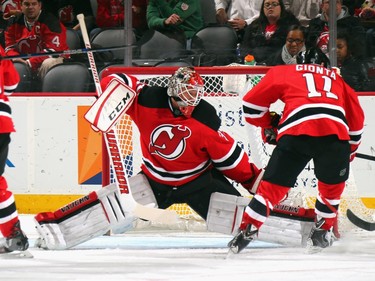Cory Schneider #35 of the New Jersey Devils makes the first period save against the Ottawa Senators.