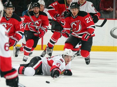 Shane Prince #10 of the Ottawa Senators and Jordin Tootoo #22 of the New Jersey Devils pursue the puck during the first period.