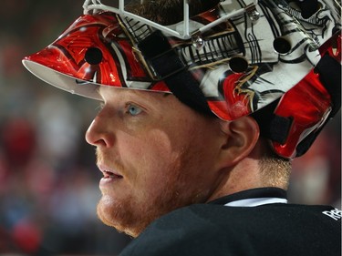 Cory Schneider #35 of the New Jersey Devils takes a break during a second period timeout.