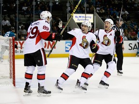 SAN JOSE, CA - JANUARY 18:  Max McCormick #89 of the Ottawa Senators is congratulated by Cody Ceci #5 and Chris Neil #25 after he scored a goal on Alex Stalock #32 of the San Jose Sharks in the first period at SAP Center on January 18, 2016 in San Jose, California.