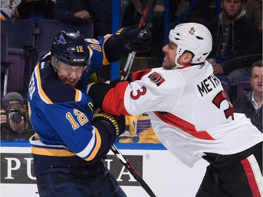 Marc Methot #3 of the Ottawa Senators defends against Jori Lehtera #12 of the St. Louis Blues.