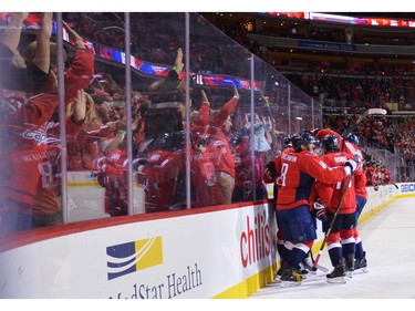 Alex Ovechkin #8 of the Washington Capitals celebrates his second goal of the game with his teammates during the game against the Ottawa Senators at the Verizon Center on January 10, 2016 in Washington, DC. The Capitals won 7-1.