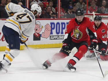 Senators Mika Zibanejad blocks  a shot from Sabres Zach Bogosian during second period action.