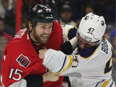Senators Zack Smith fights Sabres Zach Bogosian during first period action.