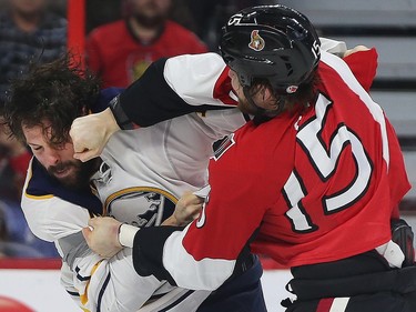 Senators Zack Smith fights Sabres Zach Bogosian during first period action.