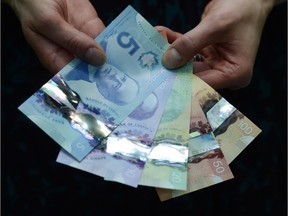 Polymer bank notes are shown during a news conference at the Bank of Canada in Ottawa on April 30, 2013. The Queen may not be the only woman featured on a Canadian bank note soon.Finance Minister Bill Morneau said he would strongly support a Bank of Canada recommendation to feature more women on Canadian currency.