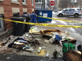 Residents' charred belongings on the sidewalk outside an early morning fire at a women's shelter on O'Connor Street Saturday, Jan. 30, 2016.