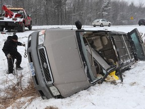 A driver was extricated from this SUV that rolled over on Innes Road Thursday Jan 28, 2016. A man was sent to hospital after being removed from the SUV.   Tony Caldwell/Postmedia Network