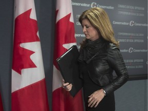 Interim Conservative Leader Rona Ambrose leaves a news conference in Ottawa, Monday, January 25, 2016.