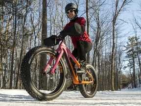Ruth Bonk rides her fat bike, a mountain bike with extra wide tires, along Trail 67 in Gatineau Park.