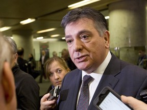 Ontario Finance Minister Charles Sousa talks to reporters at the conclusion of a meeting with Federal Finance Minister Bill Morneau and his provincial and territorial counterparts on December21, 2015.
