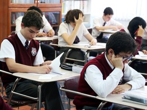 Students write a test at Ottawa's Macdonald-Cartier Academy, where exams are a cornerstone of the school's approach.