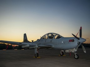 The sun rises above an A-29 Super Tucano parked on the flightline Sept. 25, 2015, at Little Rock Air Force Base, Ark. Several Super Tucano aircrews landed at The Rock to refuel and rest. The aircraft were returning to Moody AFB, Ga., after training in high altitude and mountainous terrain near Peterson AFB, Colo. (U.S. Air Force photo by Senior Airman Harry Brexel)