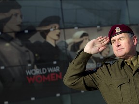 Terry Hunter and his wife Gladys Gutarra outside the Canadian War Museum Saturday January 23, 2016. Hunter noticed a Canadian War Museum poster of Second World War-era women using a wrong 'American-style' salute for the World War Women exhibit.   Ashley Fraser / Ottawa Citizen